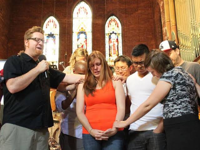 Praying over congregants